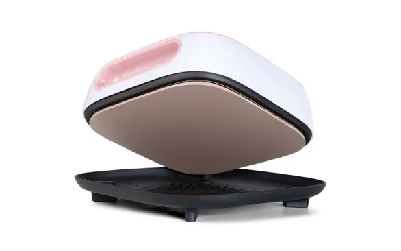 LOKLiK Easy Heat Press in romance pink seen at an angle where it is lifted from the safety base to reveal the ceramic coated heating plate.