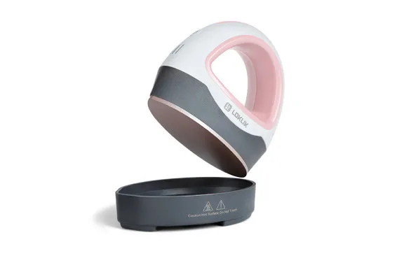 LOKLiK Mini Heat Press in romance pink seen at an angle where it is lifted from the safety base to reveal the ceramic coated heating plate.