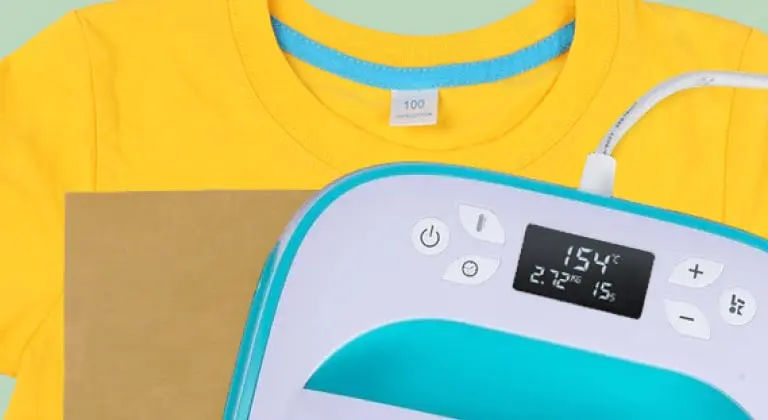 Close-up of a LOKLiK Easy Heat Press in LOKLiK Blue on top of a Teflon sheet and yellow T-shirt.