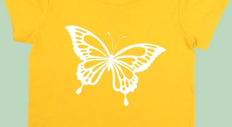 Yellow T-shirt with an iron-on print of a butterfly in white vinyl.