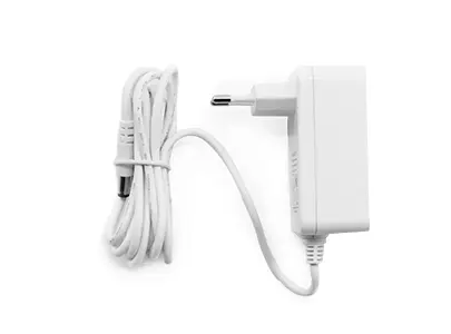 Side view of a neatly folded power adapter in white