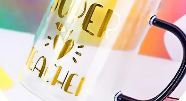 Close-up of a glass cup with a design in gold mirror metallic permanent adhesive vinyl.